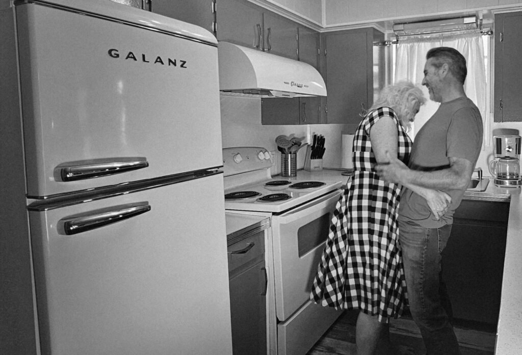 Robby and Danielle White laughing in their kitchen